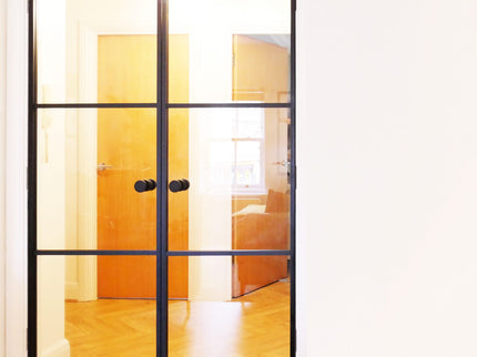 metal door with knobs in a warm environment